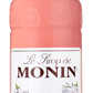 A 1-liter bottle of MONIN Cherry Blossom syrup, showcasing a pink liquid and adorned with a white label featuring floral illustrations and text in both English and French. Embrace Japanese values with "Le Sirop de MONIN Cherry Blossom," proudly highlighting "Arômes Naturels" and "Product of France." Perfect for your O-Hanami celebrations.